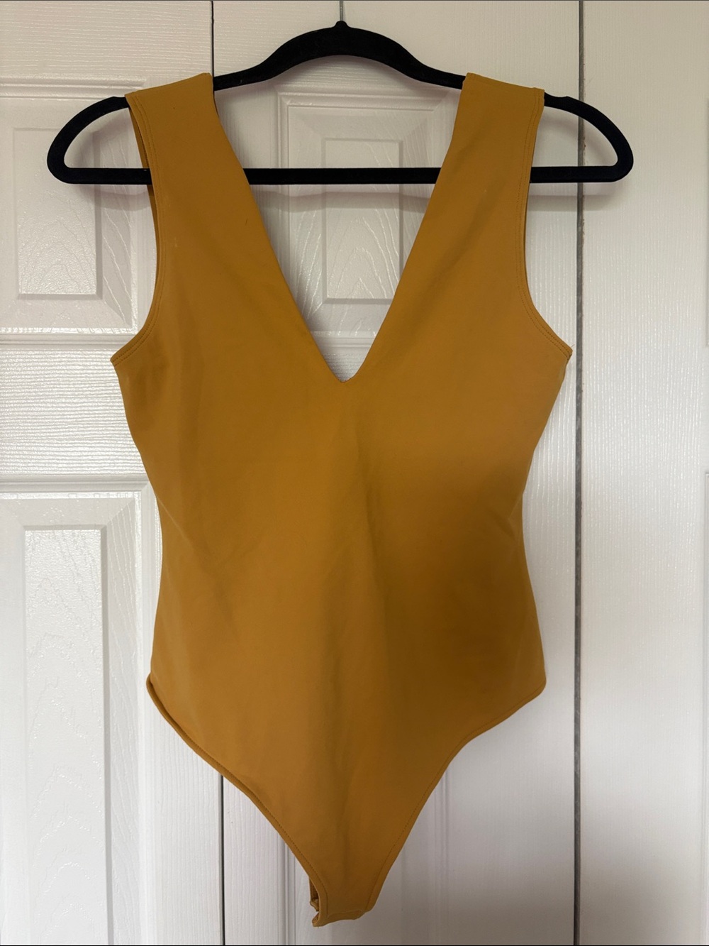 Free People Intimately "Keep It Sleek" V-Neck Bodysuit in Marigold yellow